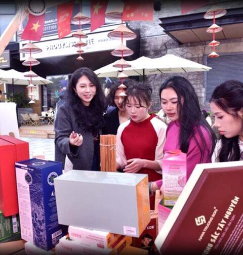 Visitors tasting Pakistani snacks at a busy Pakistani food stall during an international New Year fair in Chongqing, China.