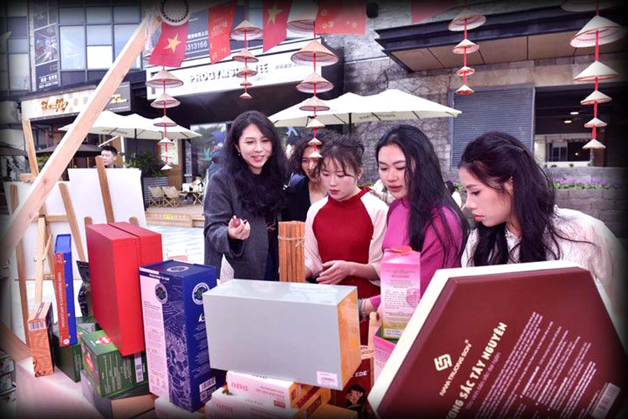 Visitors tasting Pakistani snacks at a busy Pakistani food stall during an international New Year fair in Chongqing, China.