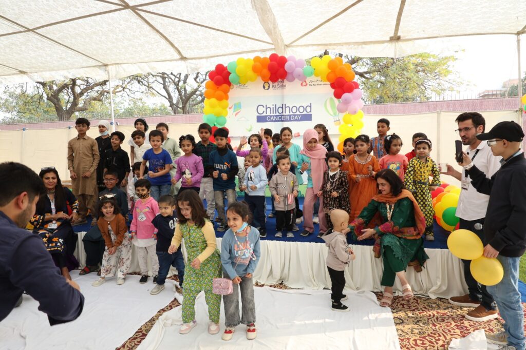 Children cancer survivors and families celebrating International Childhood Cancer Day at Aga Khan University Hospital Karachi pediatric oncology event