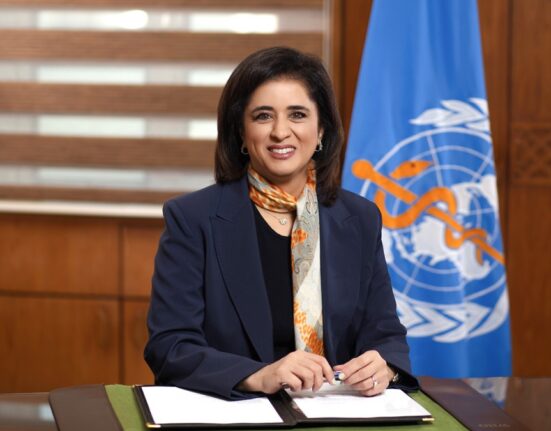 A sick person coughing in a crowded area of Karachi representing tuberculosis spread, highlighting TB symptoms and public health risks in Sindh Pakistan