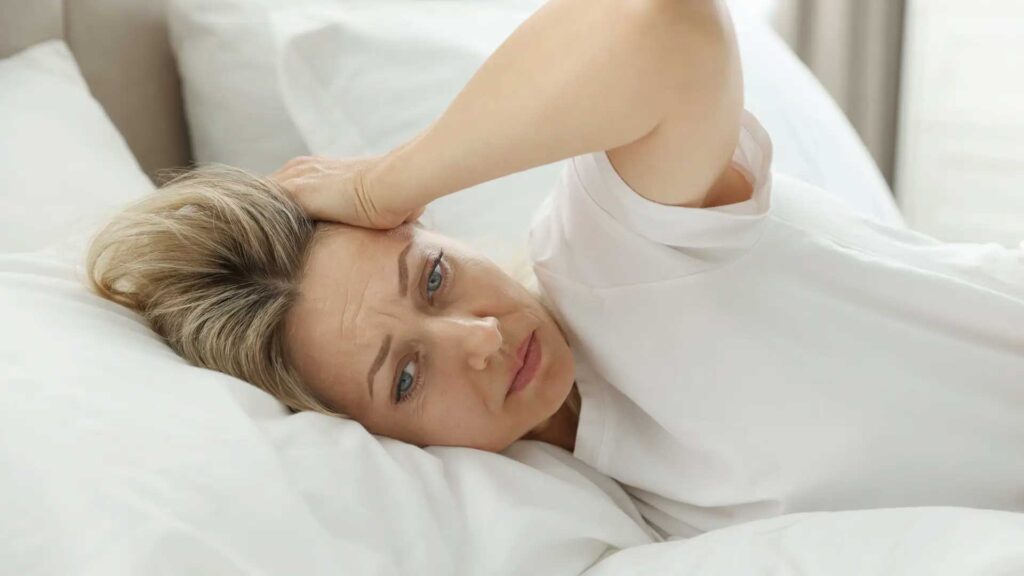 Menopause symptoms in women including hot flashes, night sweats, mood changes and skincare concerns with increasing marketing of menopause products and doctors advice for safe treatment