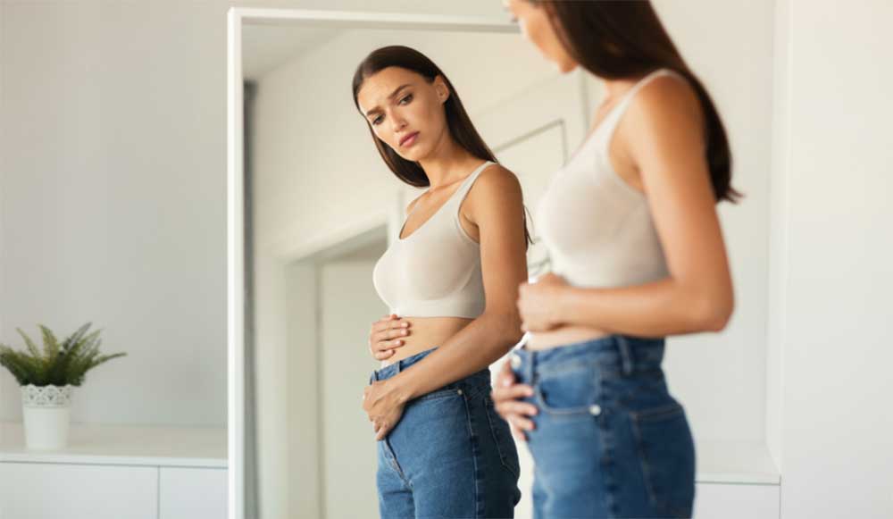 Menopause symptoms in women including hot flashes, night sweats, mood changes and skincare concerns with increasing marketing of menopause products and doctors advice for safe treatment